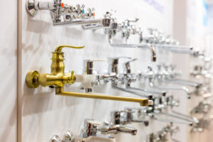 Water faucets on the shelf closeup, plumbing shop